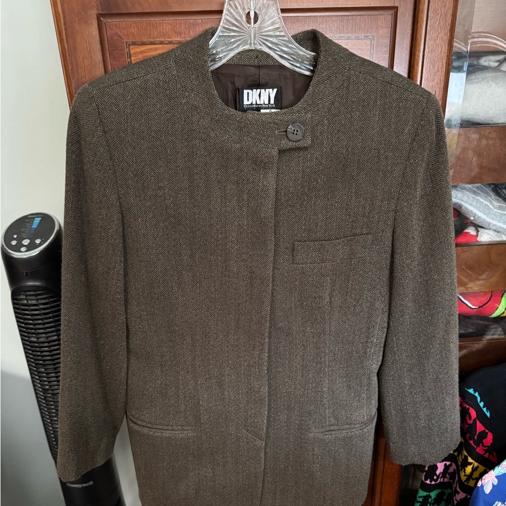 Gently used no damage DKNY suit jacket size 2 wrap around mini is size 4